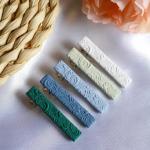 Hand-embroidered barrettes